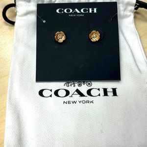 Coach gold flower earrings.